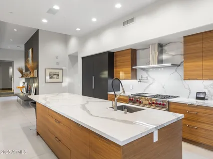 a spacious bedroom with a bed and a couch