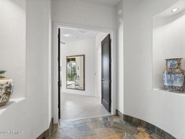 a large bathroom with a granite countertop double vanity sink and a mirror