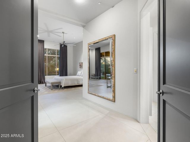 a bathroom with a tub a sink and double vanity