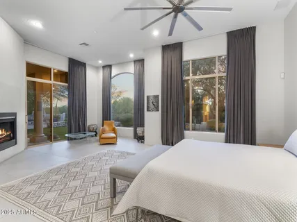 a living room with furniture a floor to ceiling window and a floor to ceiling window