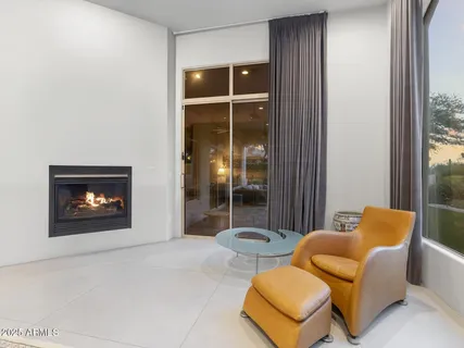a view of a patio with table and chairs with wooden floor and fence