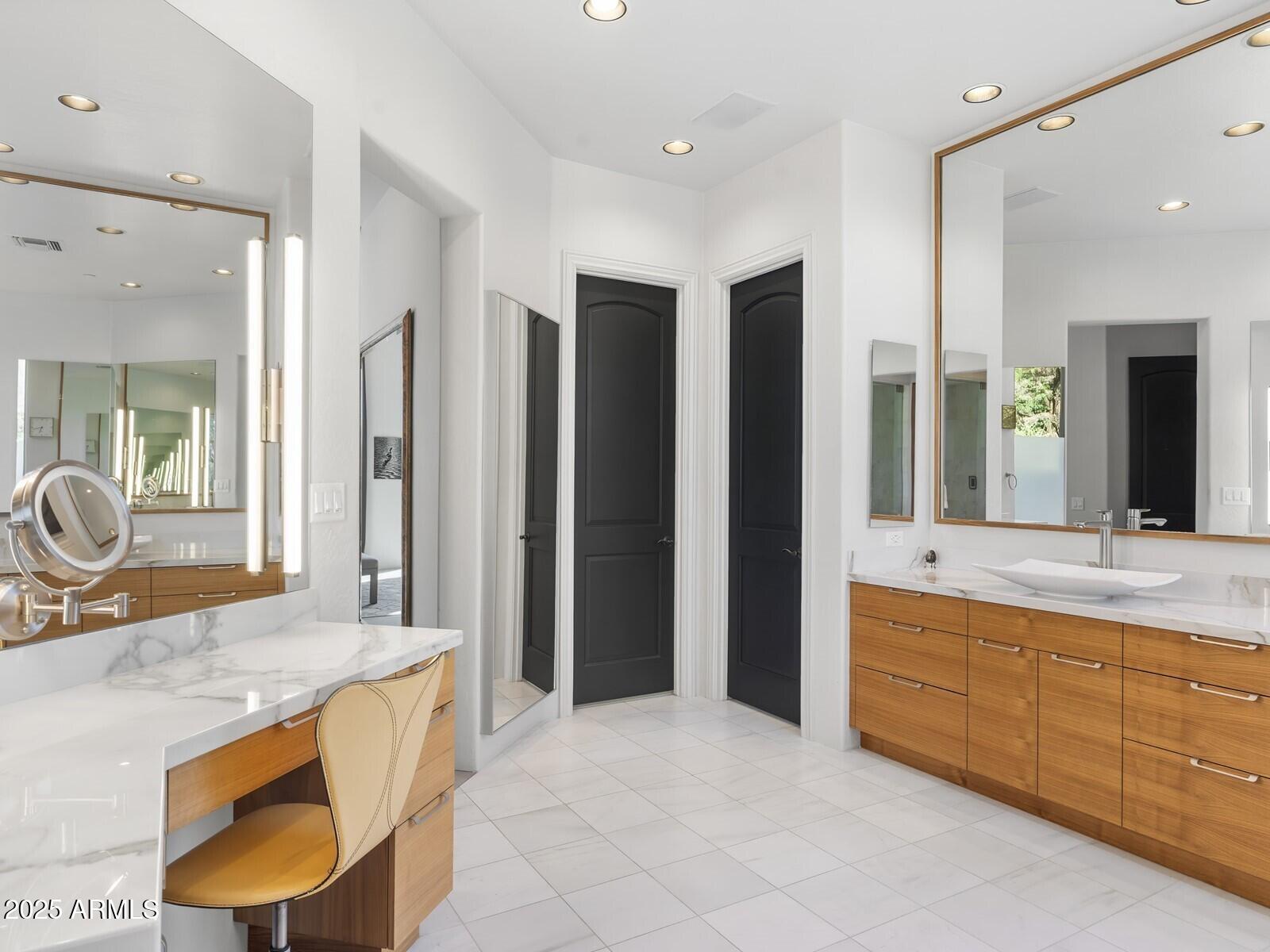 9290 East Thompson Peak Parkway, Unit 142 Scottsdale, AZ 85255 - Photo 33 of 74 a large bathroom with a granite countertop double vanity sink and a mirror