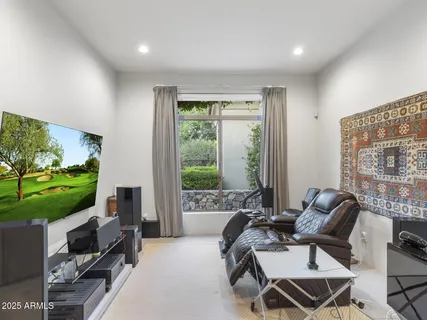 a front view of a house with swimming pool having outdoor seating