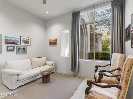 a living room with furniture and a window