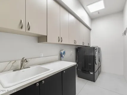 a bedroom with a bed and a lamp