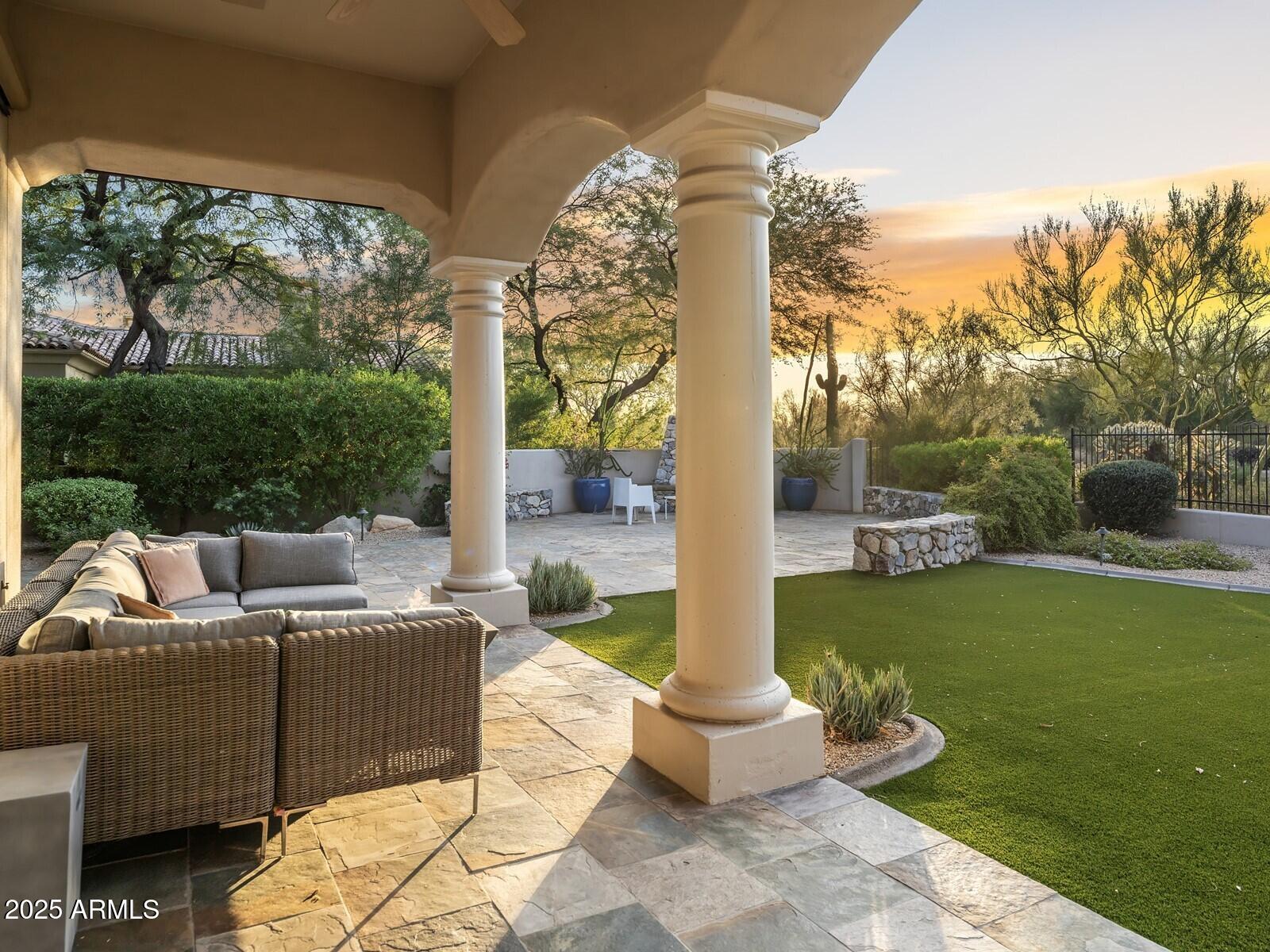 9290 East Thompson Peak Parkway, Unit 142 Scottsdale, AZ 85255 - Photo 45 of 74 a view of a patio with couches chairs and potted plants