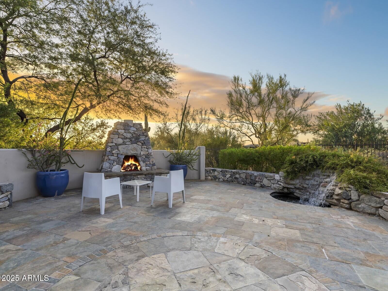 9290 East Thompson Peak Parkway, Unit 142 Scottsdale, AZ 85255 - Photo 47 of 74 a view of a tables and chairs in a backyard