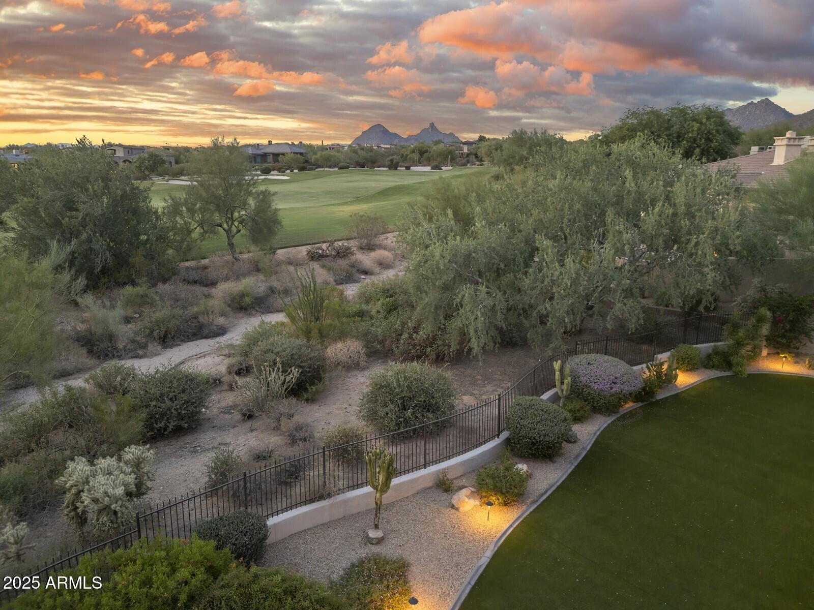 9290 East Thompson Peak Parkway, Unit 142 Scottsdale, AZ 85255 - Photo 4 of 74 a view of a lake in middle of the town