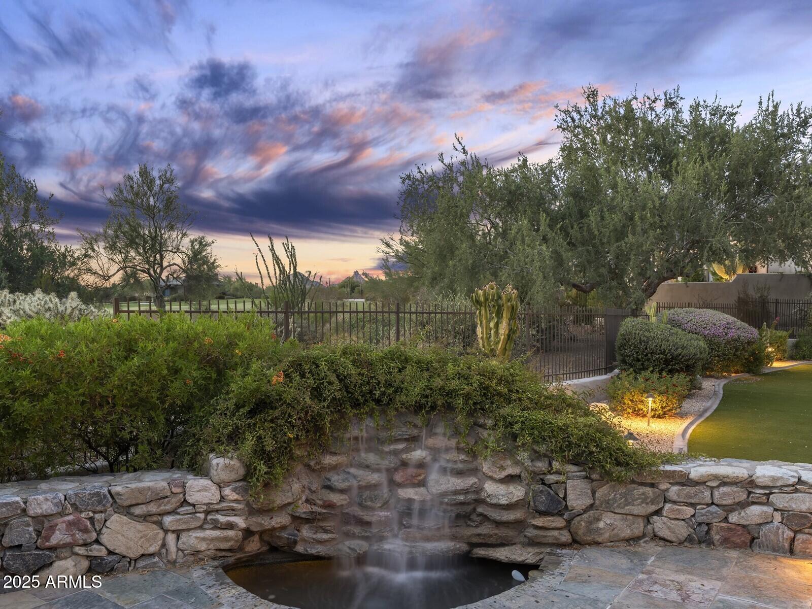 9290 East Thompson Peak Parkway, Unit 142 Scottsdale, AZ 85255 - Photo 51 of 74 a view of a lake in front of a house
