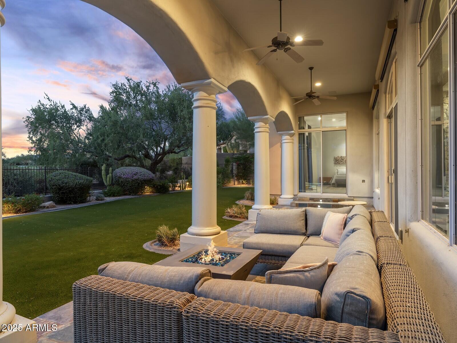9290 East Thompson Peak Parkway, Unit 142 Scottsdale, AZ 85255 - Photo 54 of 74 a outdoor living space with furniture and garden view