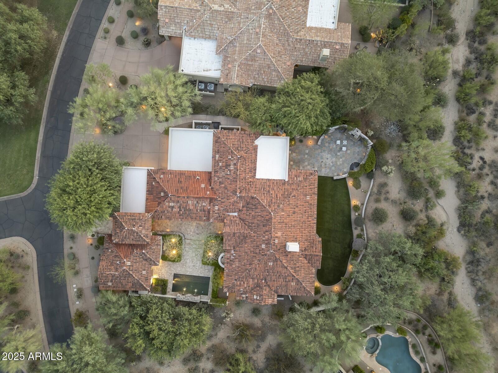 9290 East Thompson Peak Parkway, Unit 142 Scottsdale, AZ 85255 - Photo 67 of 74 an aerial view of a house with outdoor space and a lake view