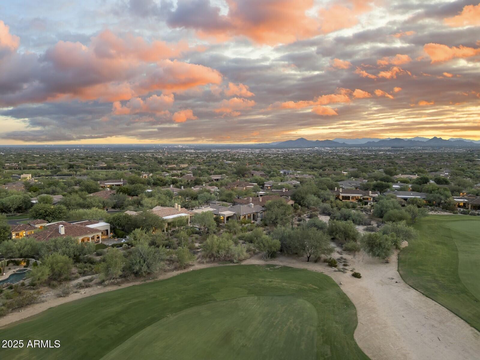 9290 East Thompson Peak Parkway, Unit 142 Scottsdale, AZ 85255 - Photo 69 of 74 an aerial view of residential houses with outdoor space and trees
