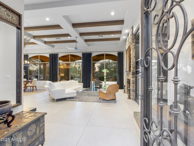 a lobby with furniture and floor to ceiling window