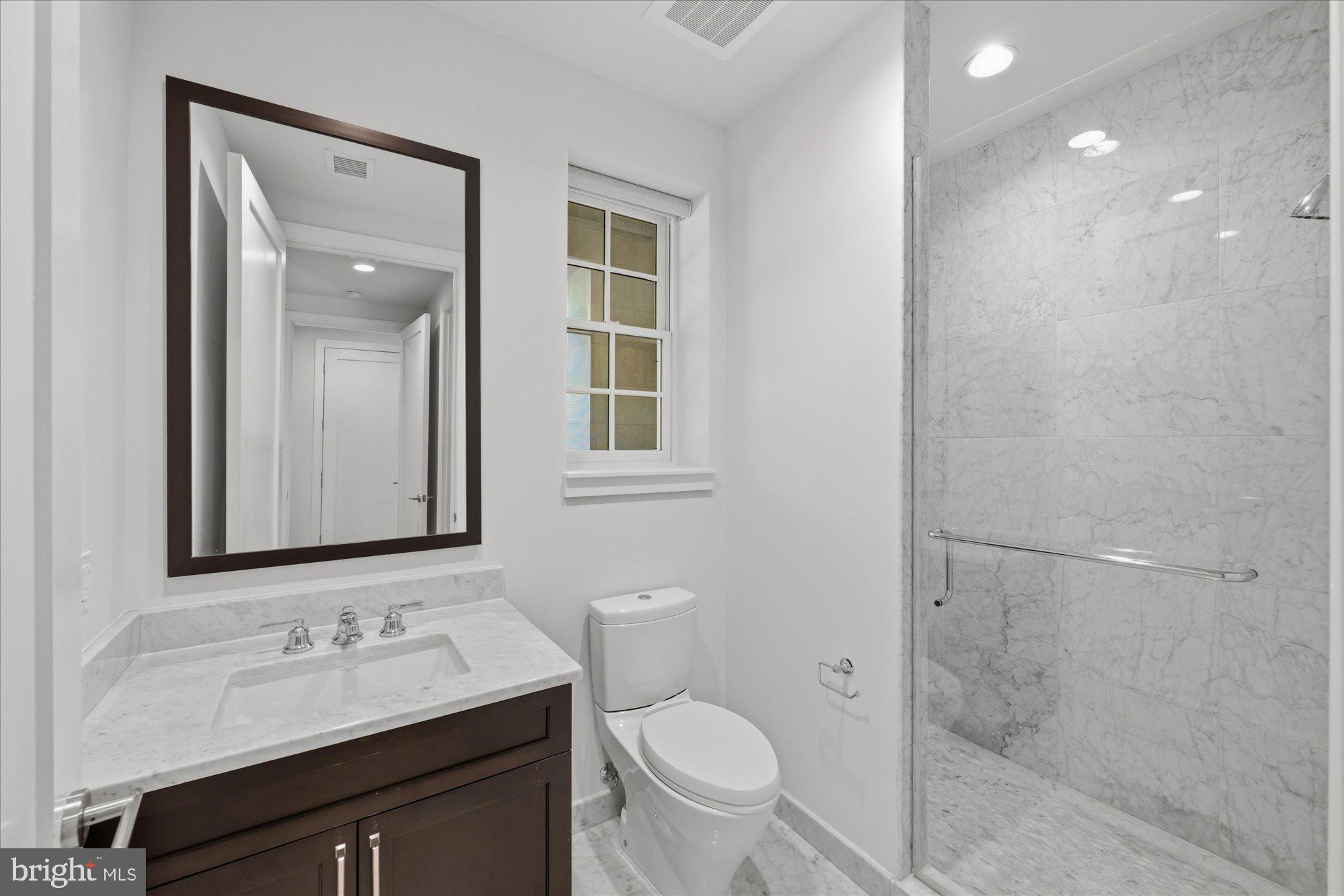 8121 River Road, Unit 423 Bethesda, MD 20817 - Photo 53 of 79 Guest Bathroom with Electric Blinds