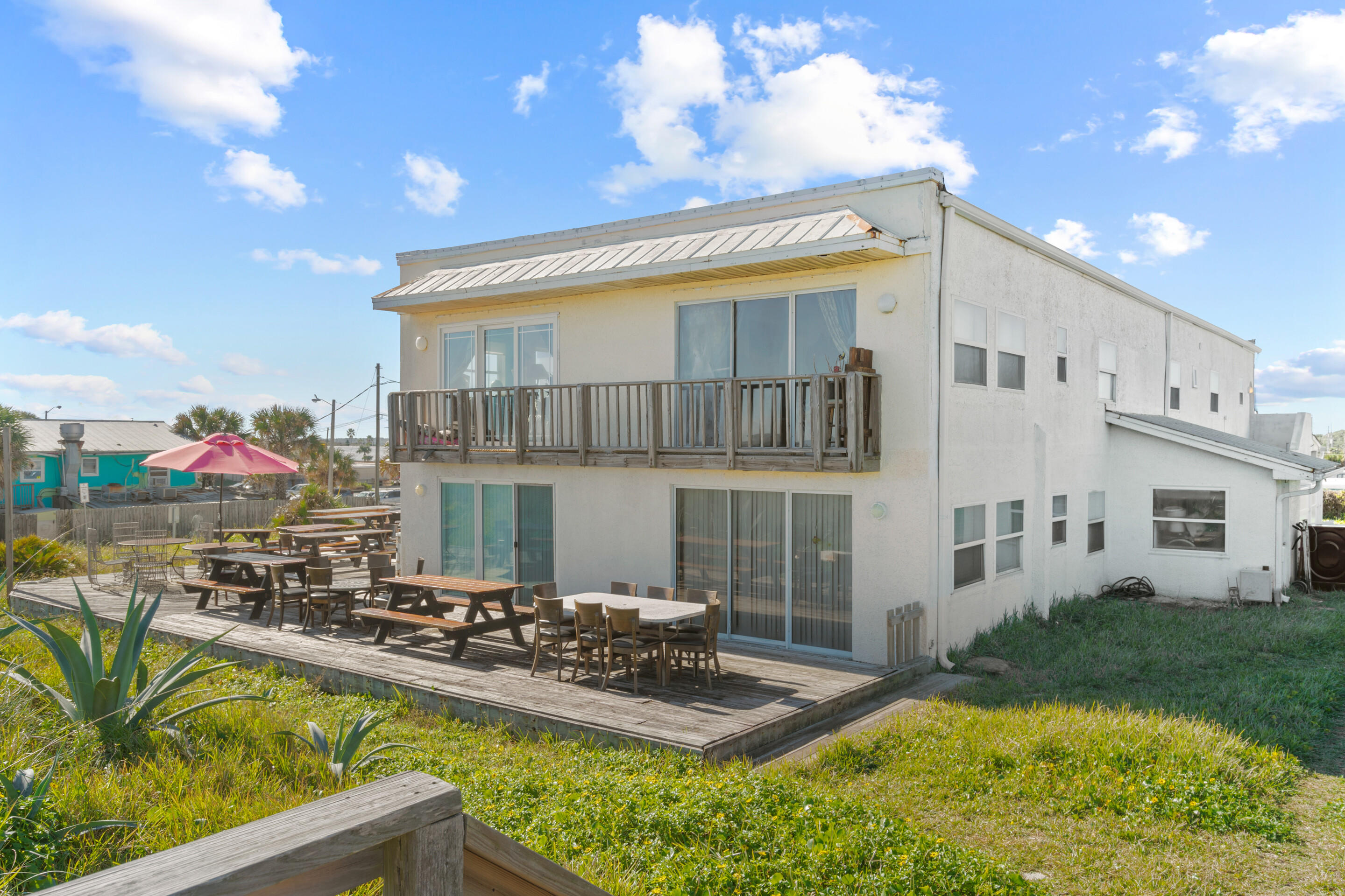 50 Cubbedge Road St. Augustine, FL 32080 - Photo 21 of 26 a view of a house with swimming pool and sitting area