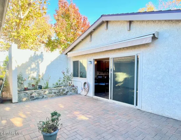 a view of a backyard of the house