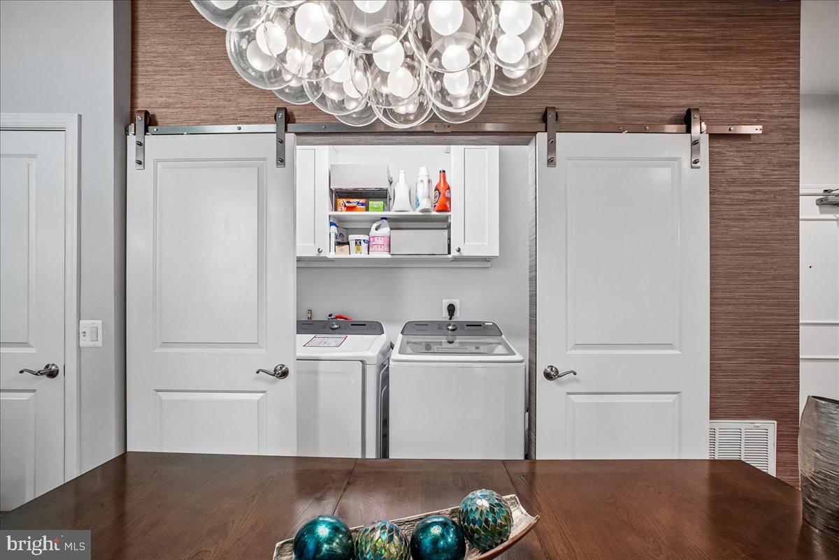 3650 South Glebe Road, Unit 157 Arlington, VA 22202 - Photo 21 of 54 Sleek laundry space behind sliding doors.