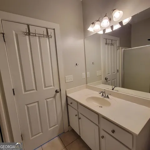 a bathroom with a double vanity sink a and a mirror