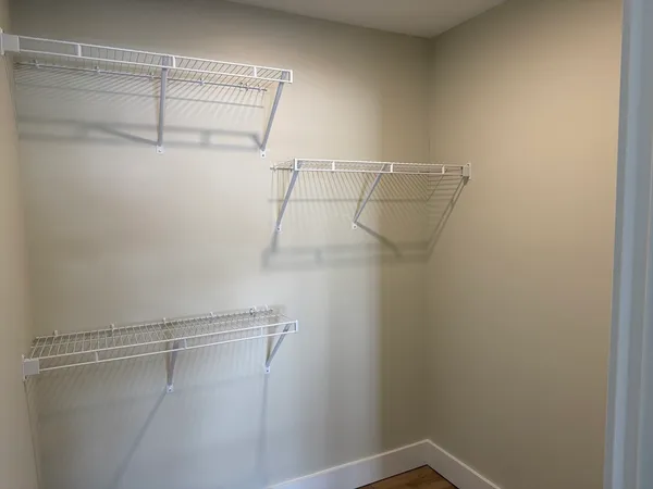 a view of a room with racks on the wall