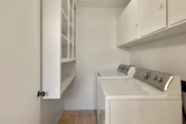 a bathroom with a sink mirror vanity and toilet