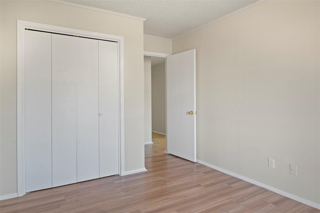 3718 West Rochelle Road Irving, TX 75062 - Photo 21 of 29 a view of an empty room with wooden floor
