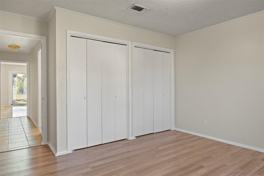 3718 West Rochelle Road Irving, TX 75062 - Photo 22 of 29 a view of an empty room with wooden floor