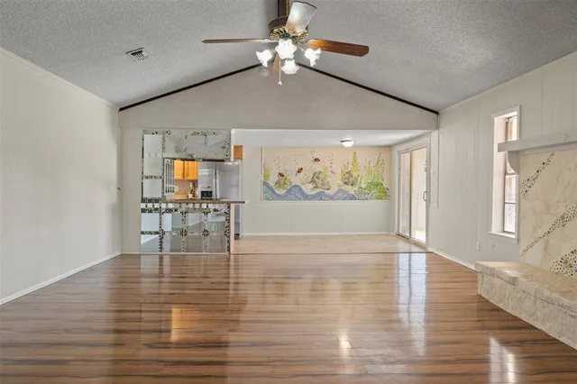 a view of dining room with wooden floor and chandelier