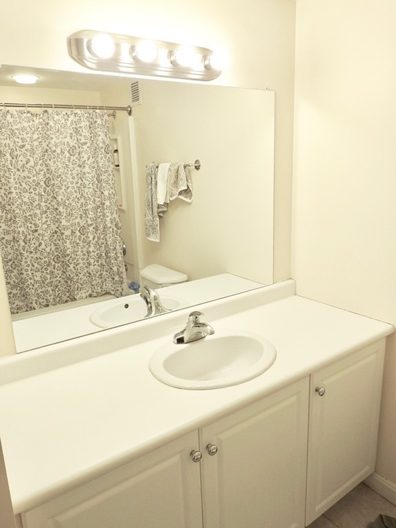 8 Museum Way, Unit 1305 Cambridge, MA 02141 - Photo 12 of 23 a bathroom with a sink and a mirror
