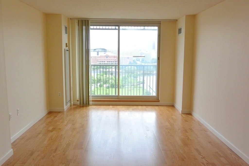 8 Museum Way, Unit 1305 Cambridge, MA 02141 - Photo 6 of 23 a view of room with window and wooden floor