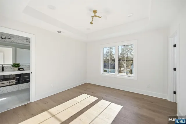 a bed room with a bed and a chair