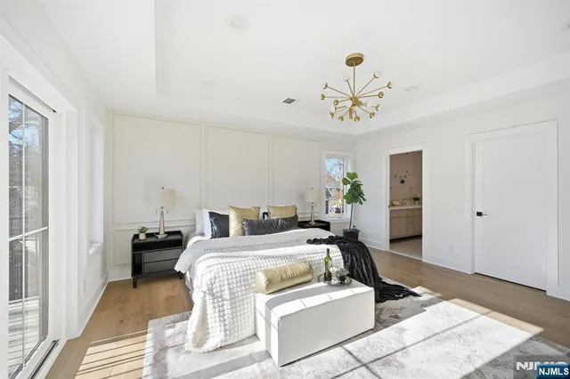 a spacious bedroom with a large bed and a window