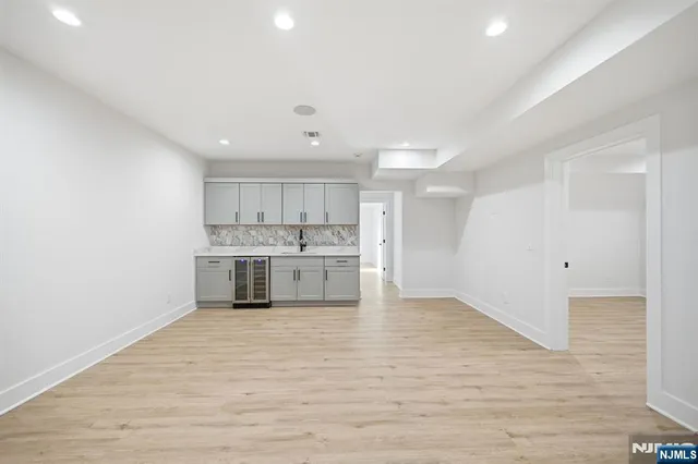 a view of a kitchen with granite countertop cabinets and wooden floor