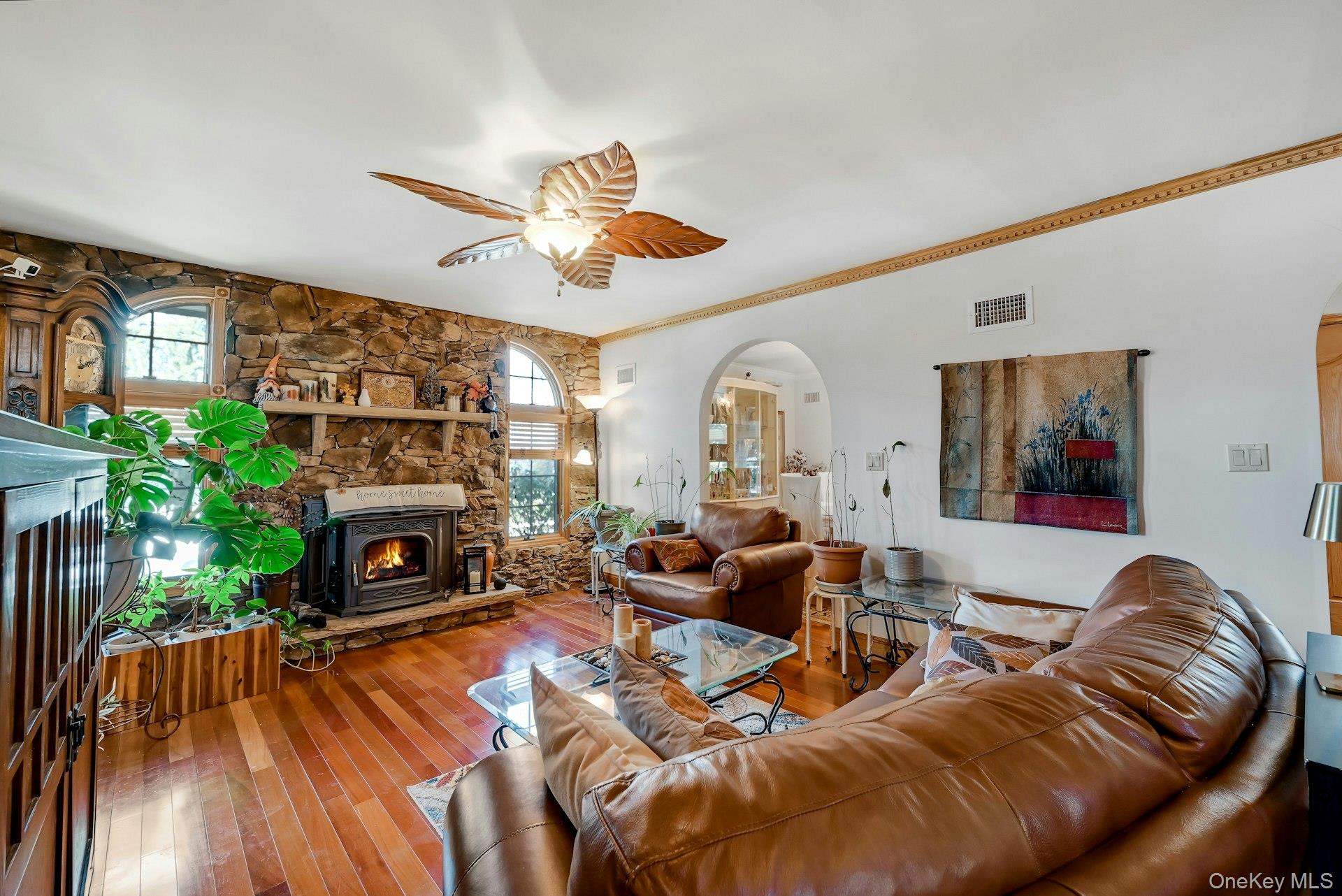 236 Valley Road Valley Cottage, NY 10989 - Photo 11 of 35 a living room with furniture a fireplace and a flat screen tv
