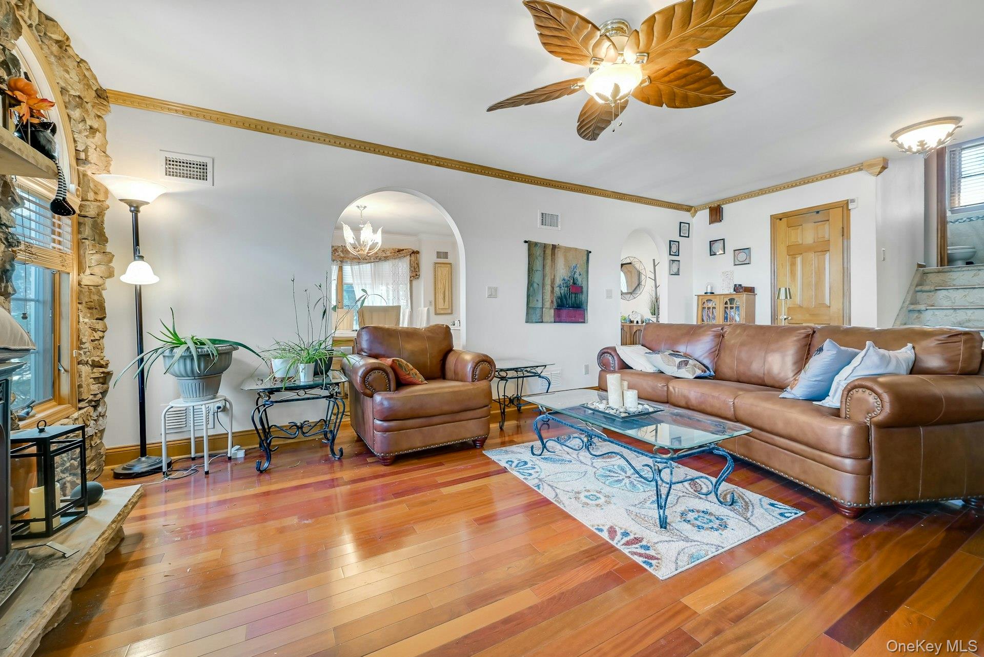 236 Valley Road Valley Cottage, NY 10989 - Photo 13 of 35 a living room with furniture a chandelier and a flat screen tv