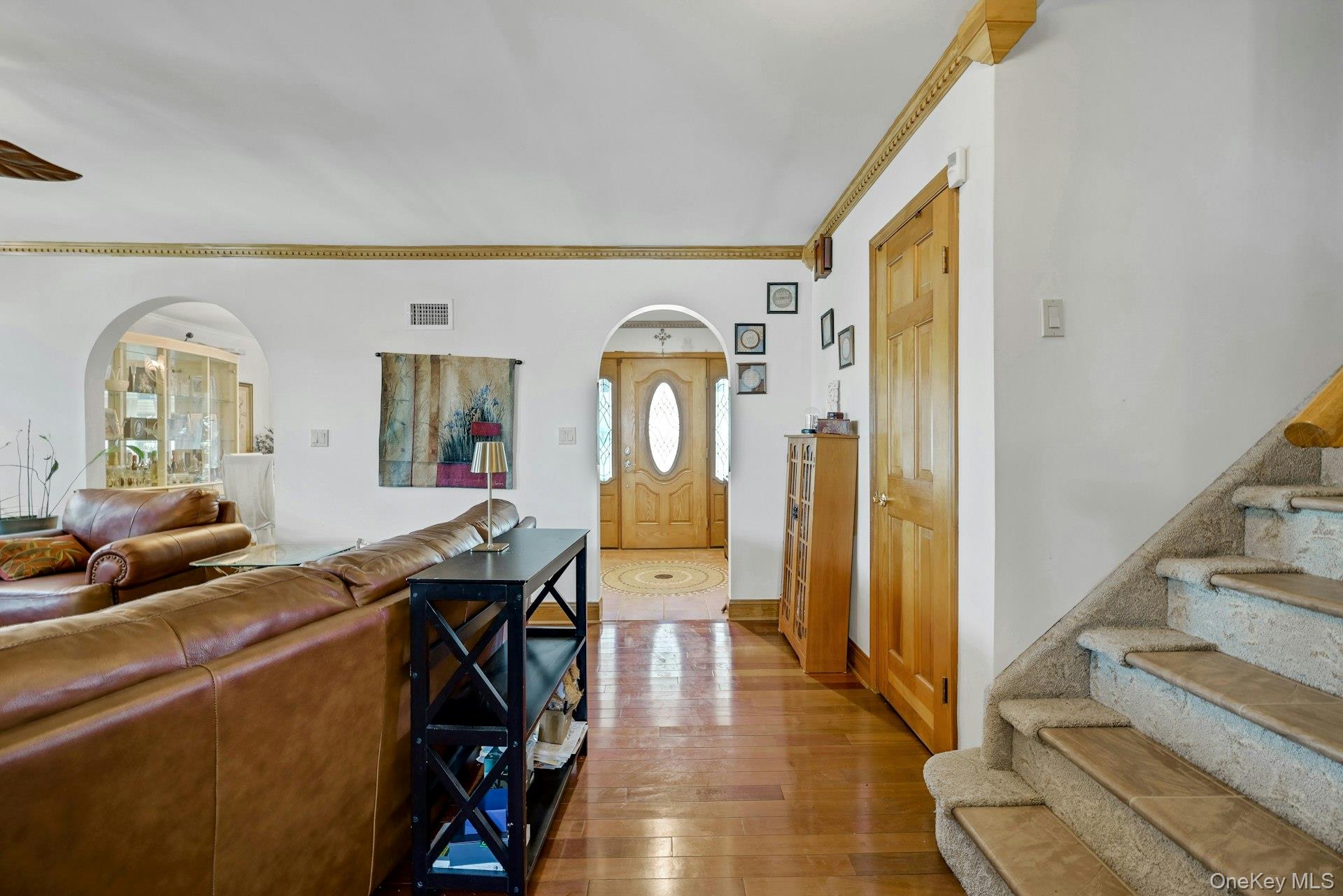 236 Valley Road Valley Cottage, NY 10989 - Photo 17 of 35 a view of a livingroom with furniture wooden floor mirror and a chandelier