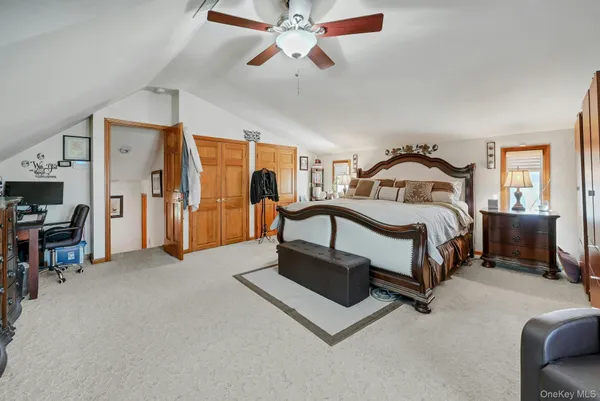 a view of a hallway with a door and windows
