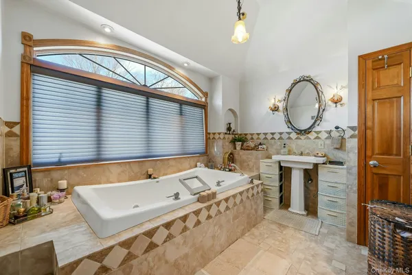 a bathroom with a sink a toilet and a window