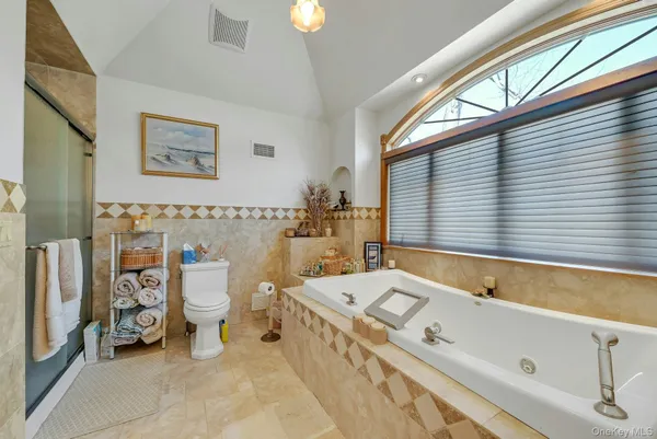 a living room with furniture gym equipment and a floor to ceiling window