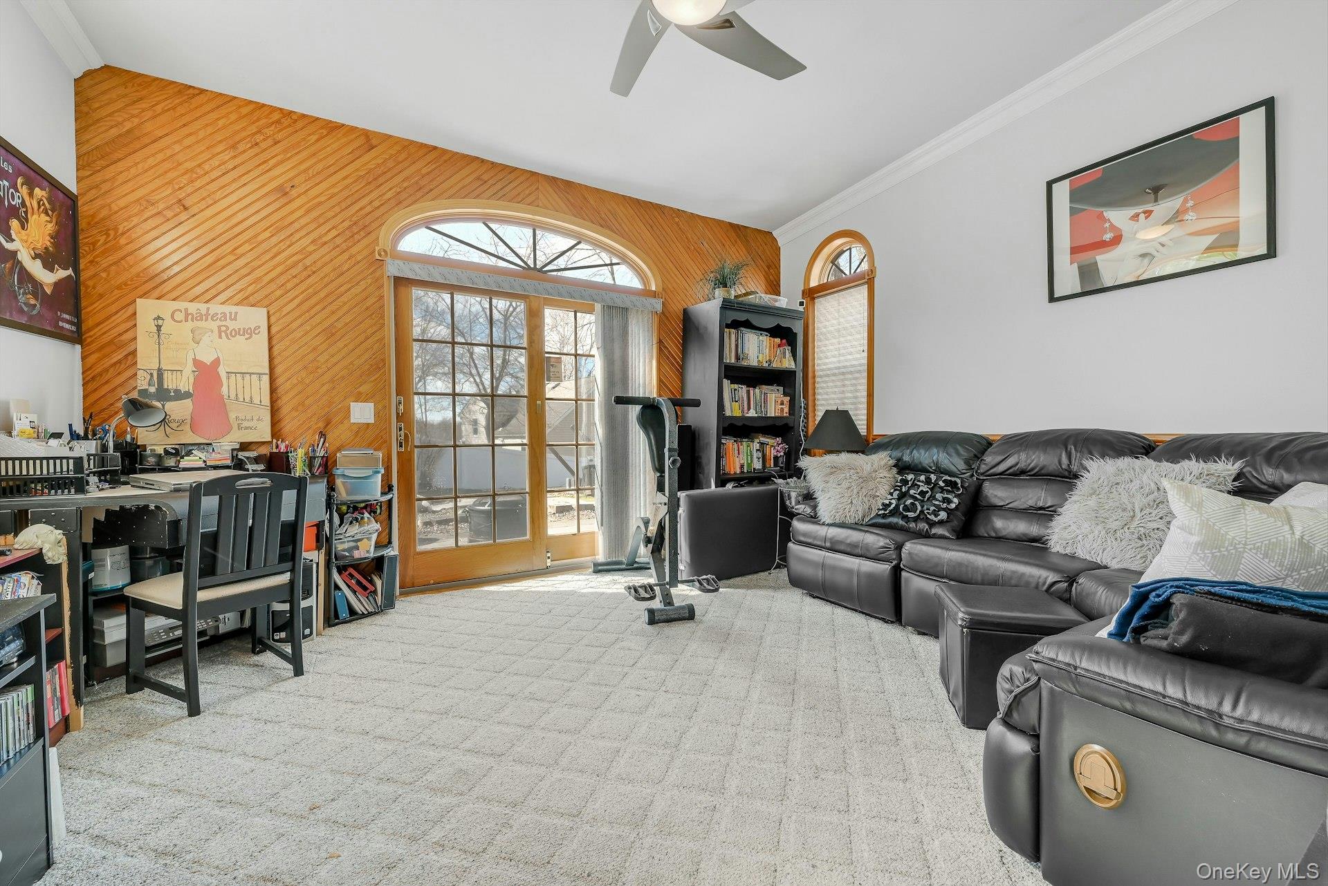 236 Valley Road Valley Cottage, NY 10989 - Photo 29 of 35 a living room with furniture gym equipment and a floor to ceiling window