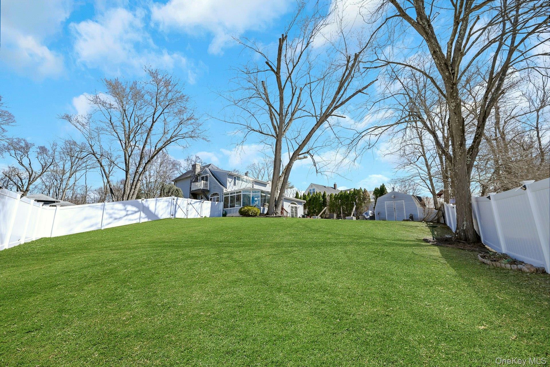 236 Valley Road Valley Cottage, NY 10989 - Photo 34 of 35 a view of a backyard with large trees