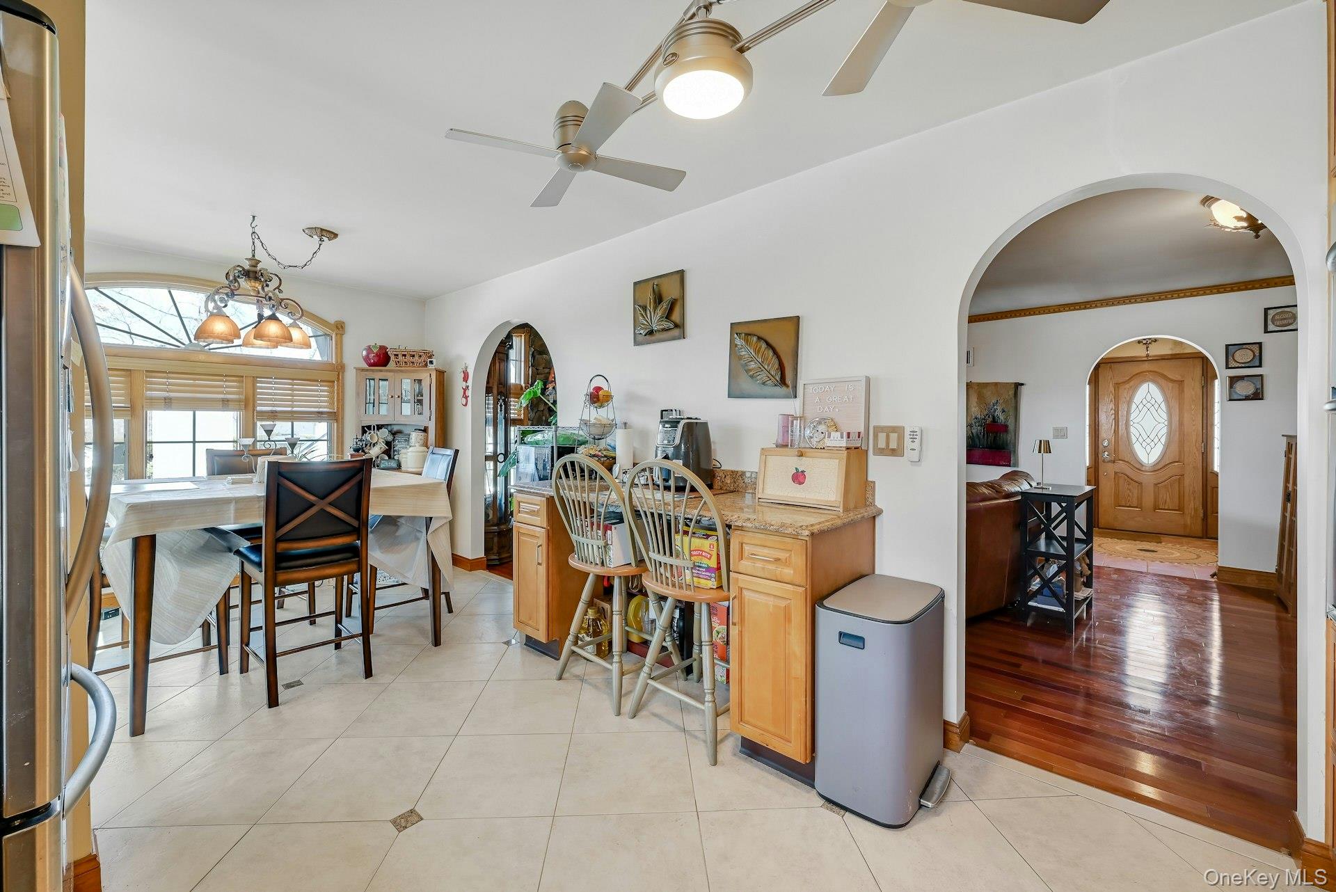 236 Valley Road Valley Cottage, NY 10989 - Photo 5 of 35 a living room with furniture a dining table and chairs with wooden floor