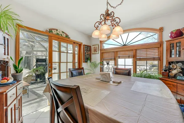a view of a dining room with furniture window and outside view