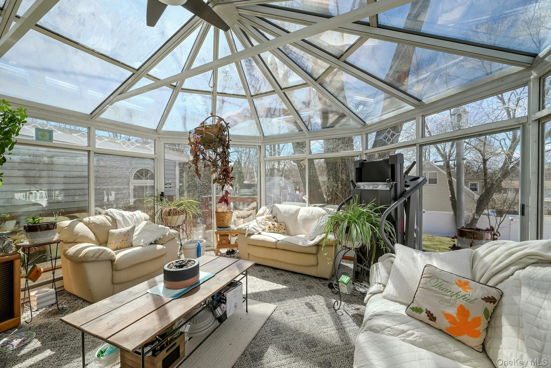 236 Valley Road Valley Cottage, NY 10989 - Photo 8 of 35 a living room with furniture a ceiling fan and a window