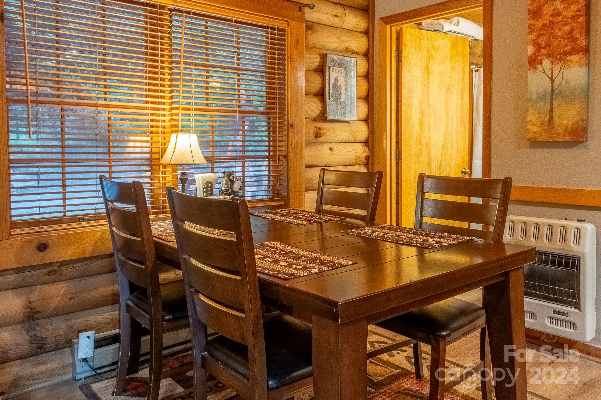 274 Hemlock Road Banner Elk, NC 28604 - Photo 15 of 46 a view of a balcony dining table and chairs