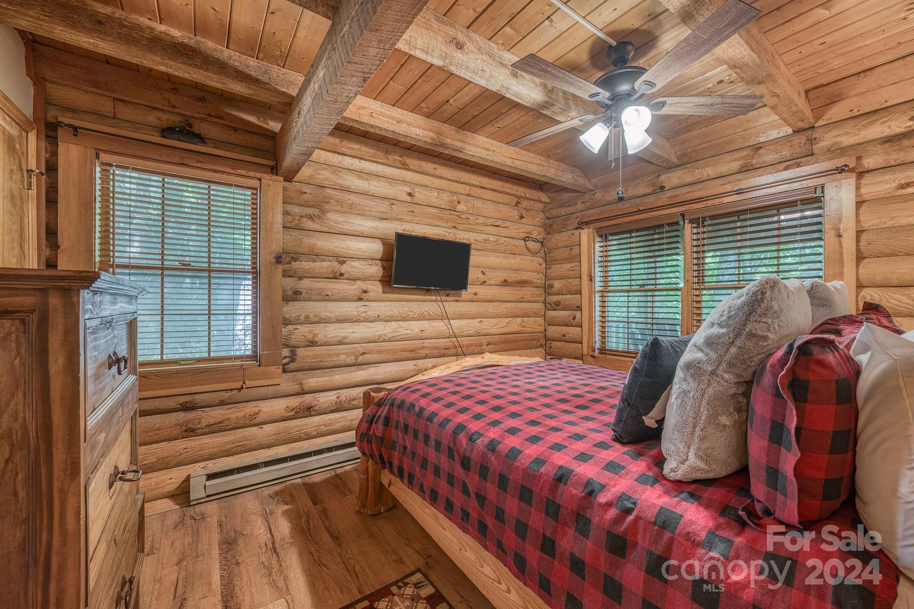 274 Hemlock Road Banner Elk, NC 28604 - Photo 17 of 46 a bedroom with a bed and a window