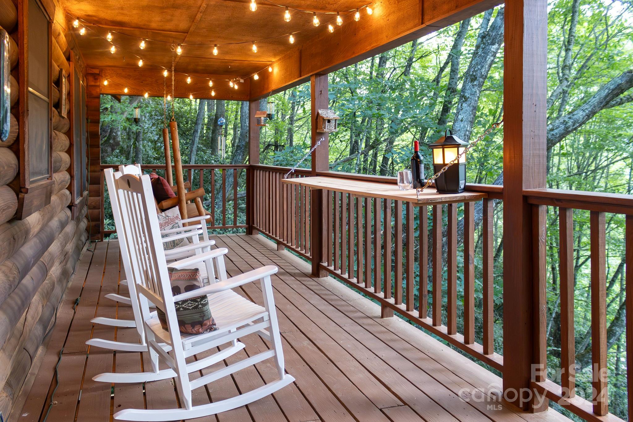 274 Hemlock Road Banner Elk, NC 28604 - Photo 24 of 46 a view of balcony with wooden floor and outdoor seating