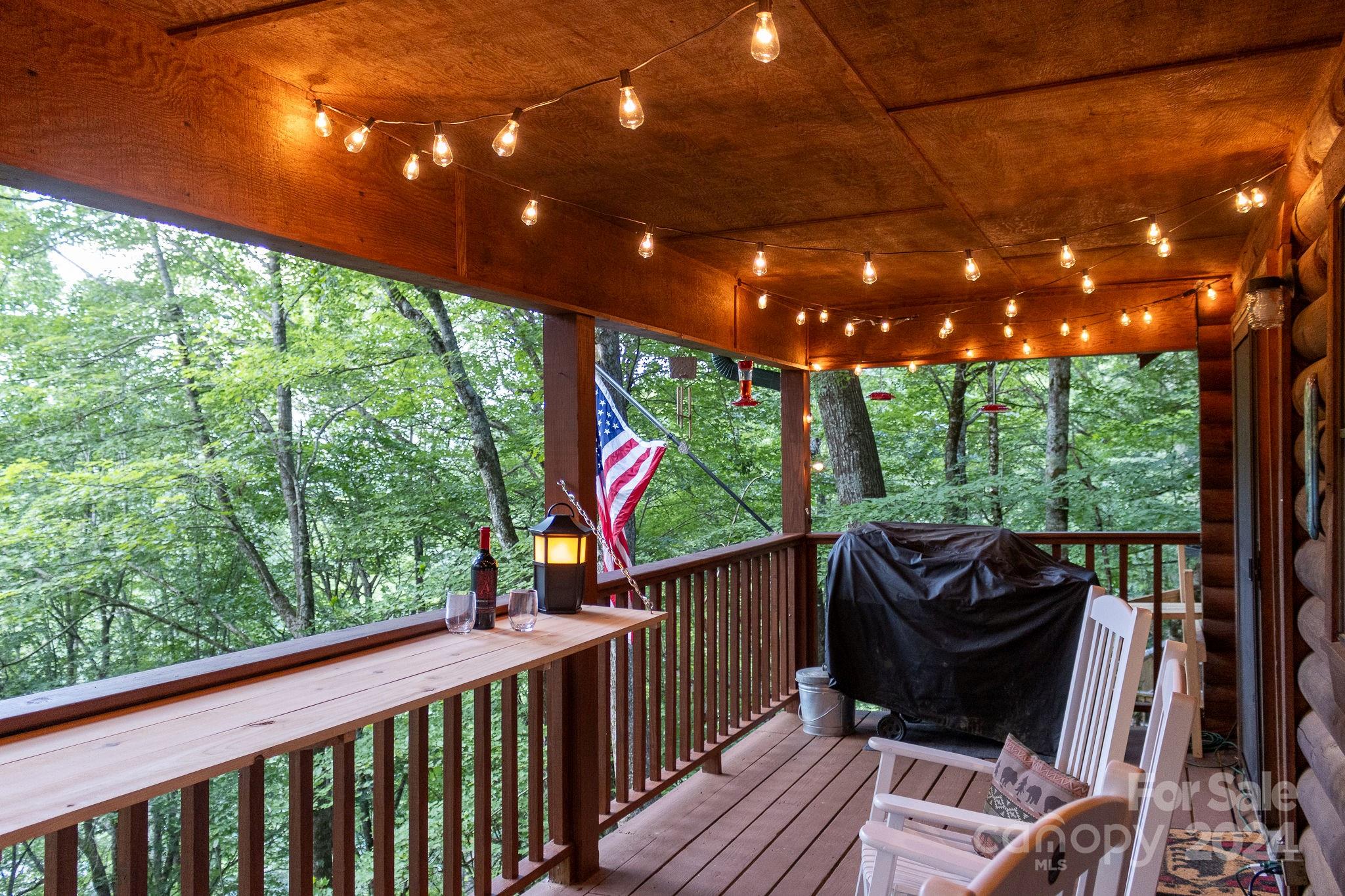 274 Hemlock Road Banner Elk, NC 28604 - Photo 26 of 46 a view of balcony with couch and wooden floor