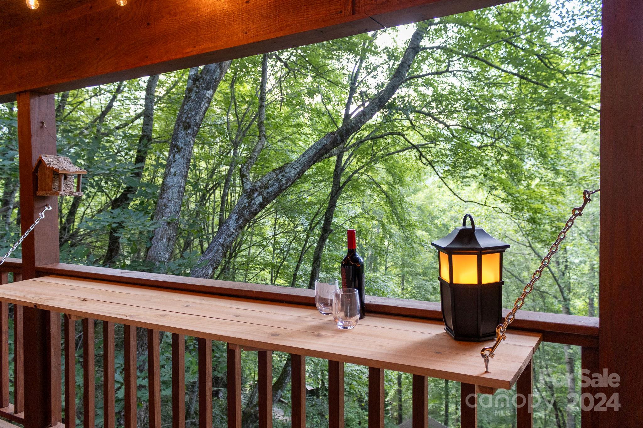 274 Hemlock Road Banner Elk, NC 28604 - Photo 27 of 46 a view of a porch with a yard