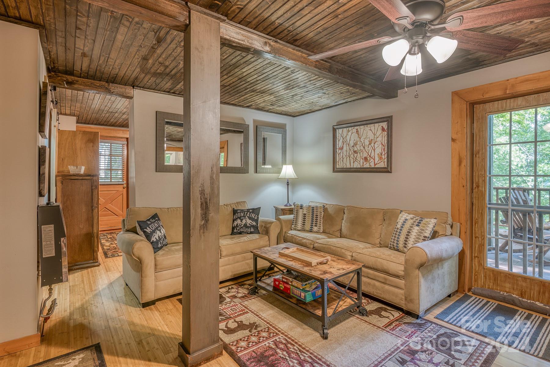274 Hemlock Road Banner Elk, NC 28604 - Photo 30 of 46 a living room with furniture and wooden floor