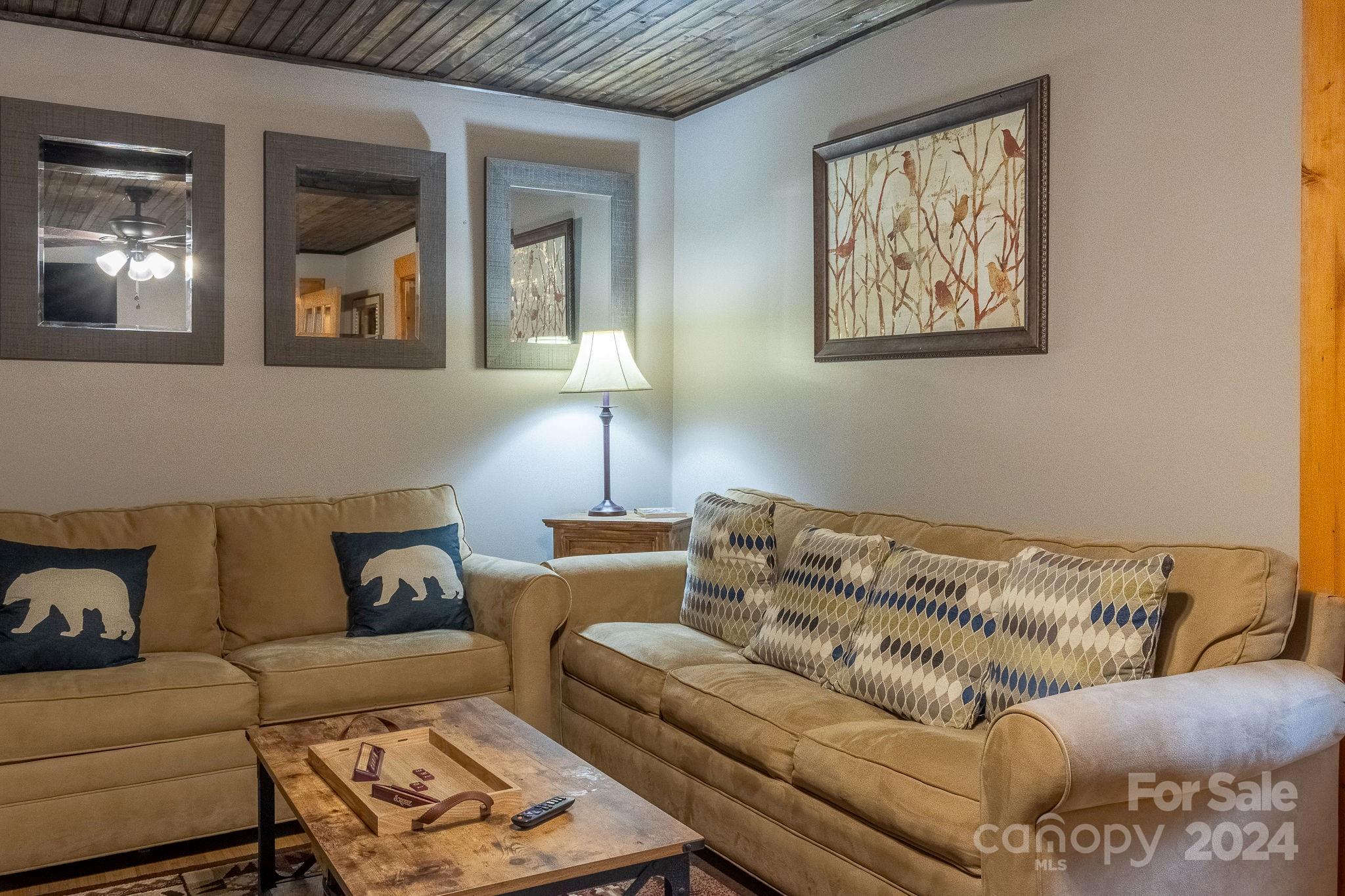 274 Hemlock Road Banner Elk, NC 28604 - Photo 31 of 46 a living room with furniture and painting on the wall